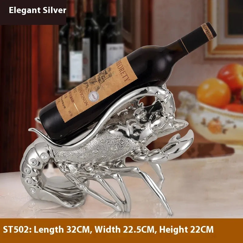 Rose gold resin lobster ornament holding a wine bottle on a wooden shelf.