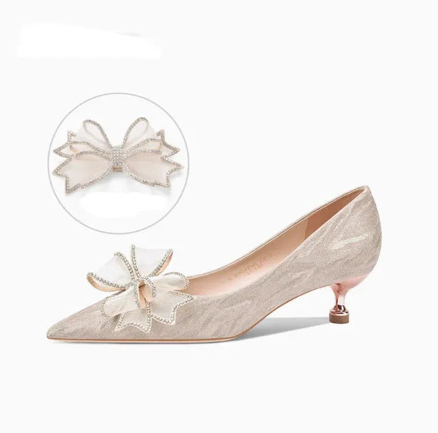 Women's champagne gold stiletto high heels covered in crystal sequins with a pointed toe.