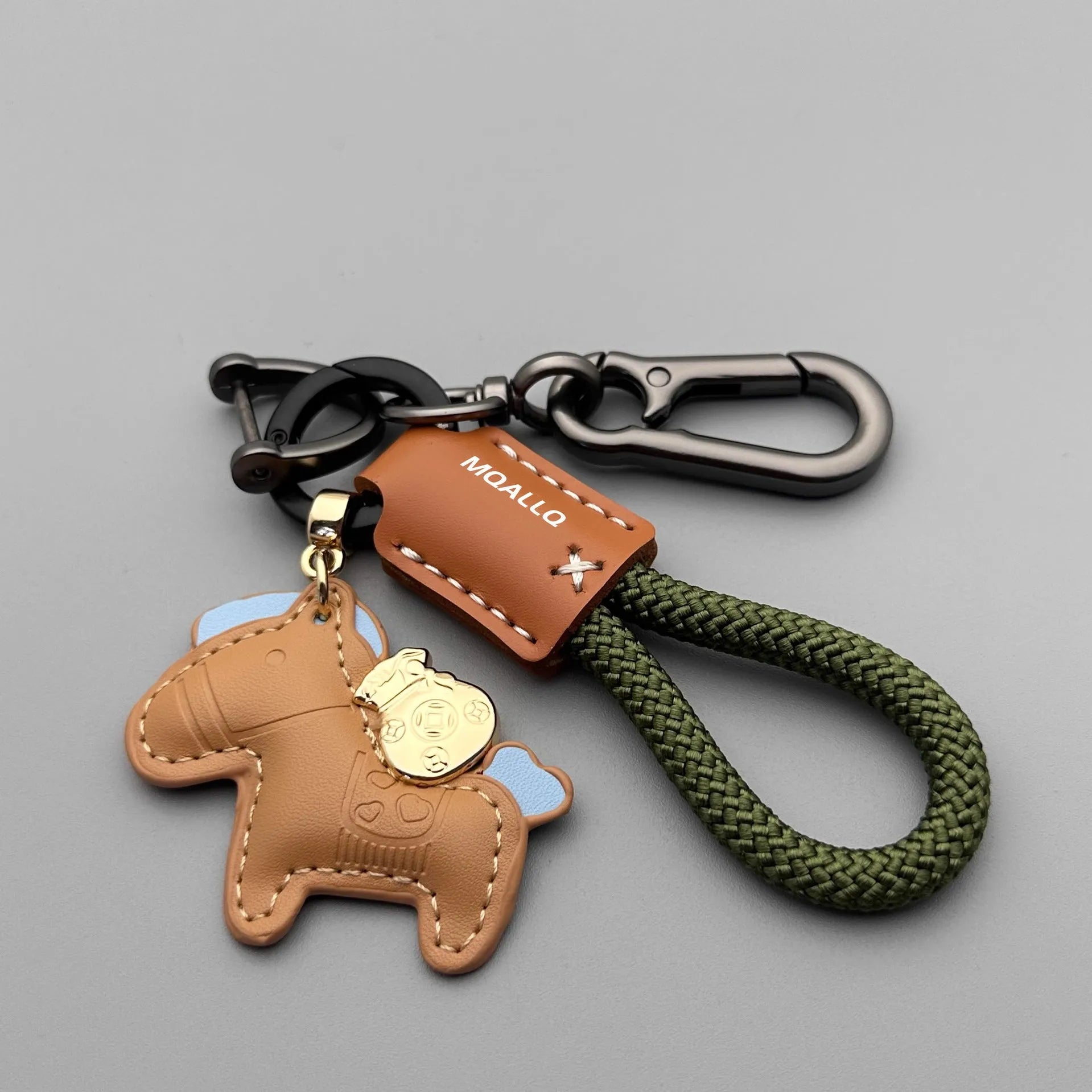 Handmade brown cowhide leather car key ring pendant with a zinc alloy belt buckle and green flanelle rope.
