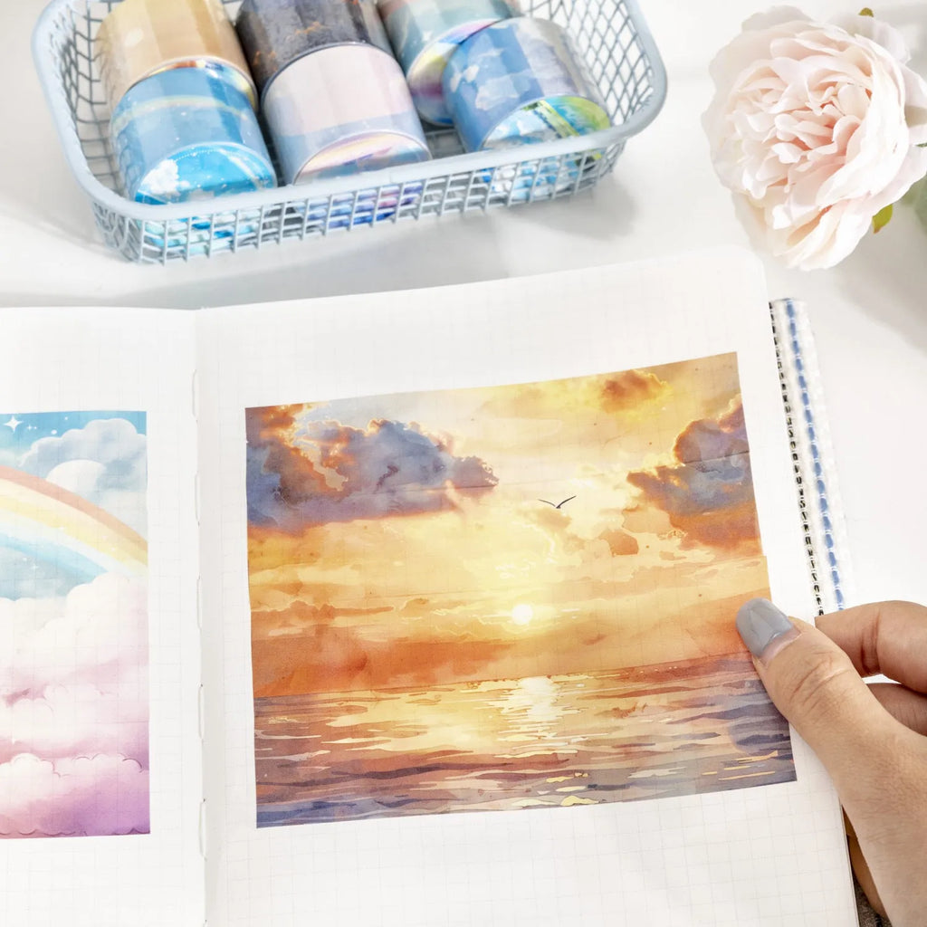 Roll of Japanese paper washi tape with sky theme designs showing colourful cloud pattern