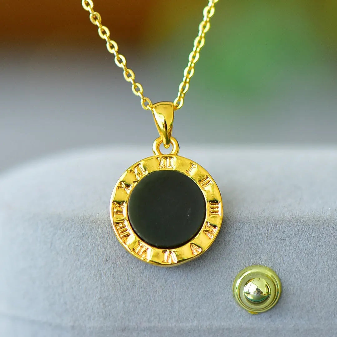 Flat gray and ink blue Hetian Jade pendant with copper inlaid decoration on a necklace.