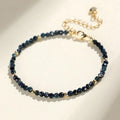 Blue tourmaline bracelet with 3mm beads and spacer bead design on wrist