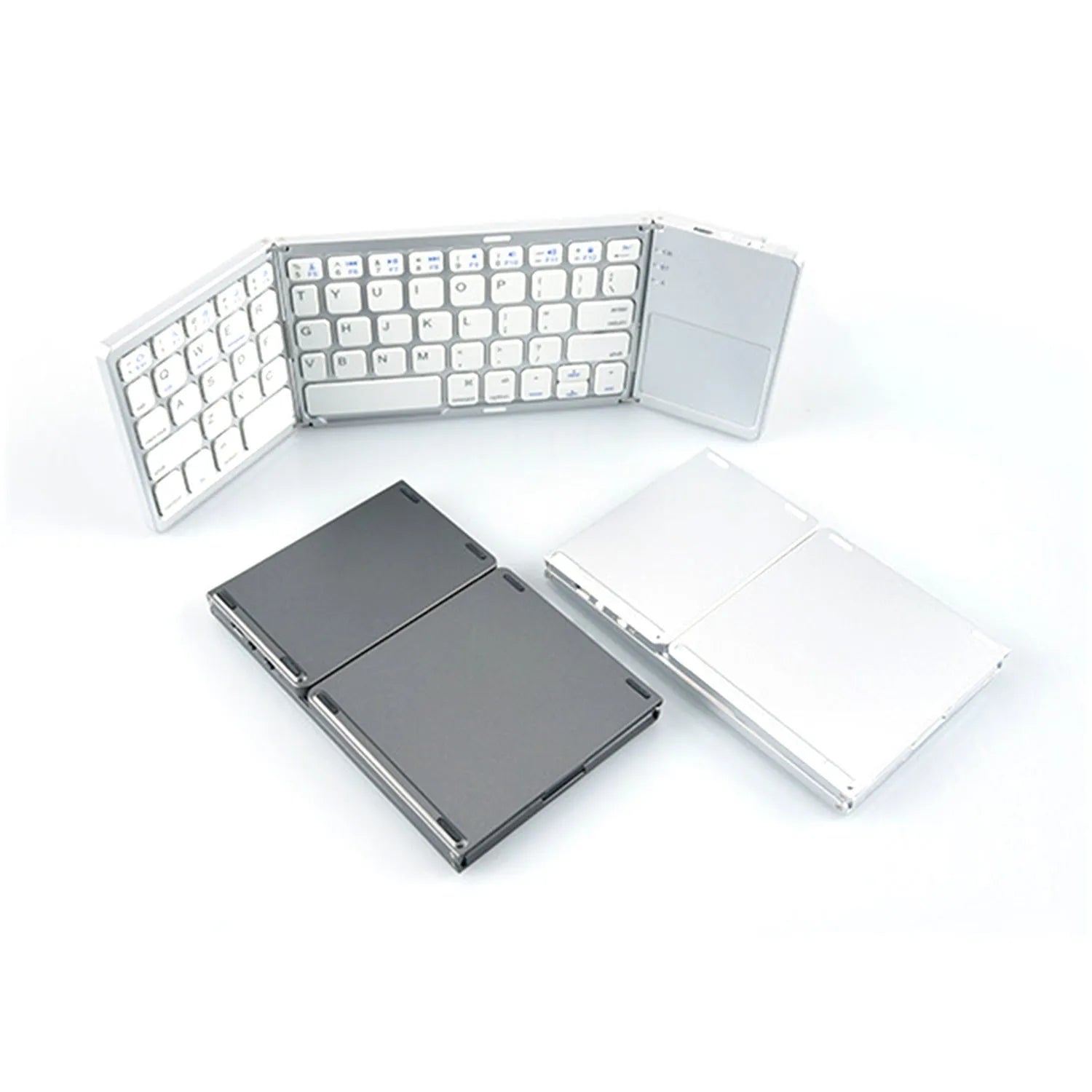 Black mini tri-fold Bluetooth keyboard shown folded and unfolded next to a mobile phone.