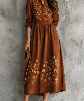 Brown knee-length vintage dress with floral embroidery on suede-like material.