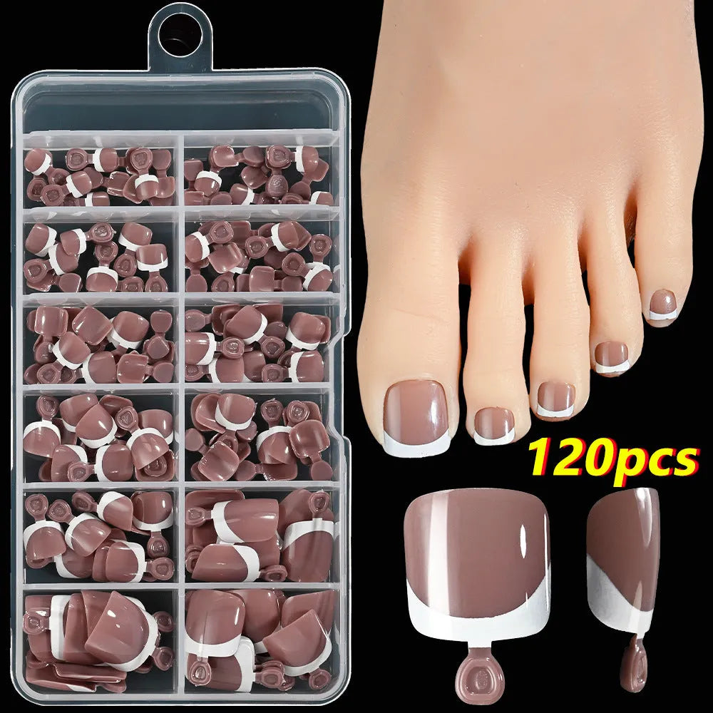 120-piece box of French white tip false toenails in nude colours, square short shape.