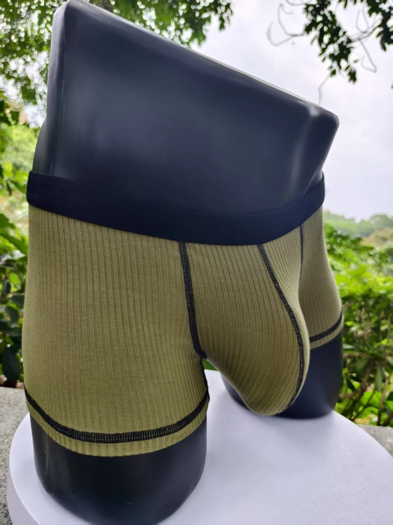 Men's breathable boxers in Army Green solid colour showing thin fabric construction and body shaping design