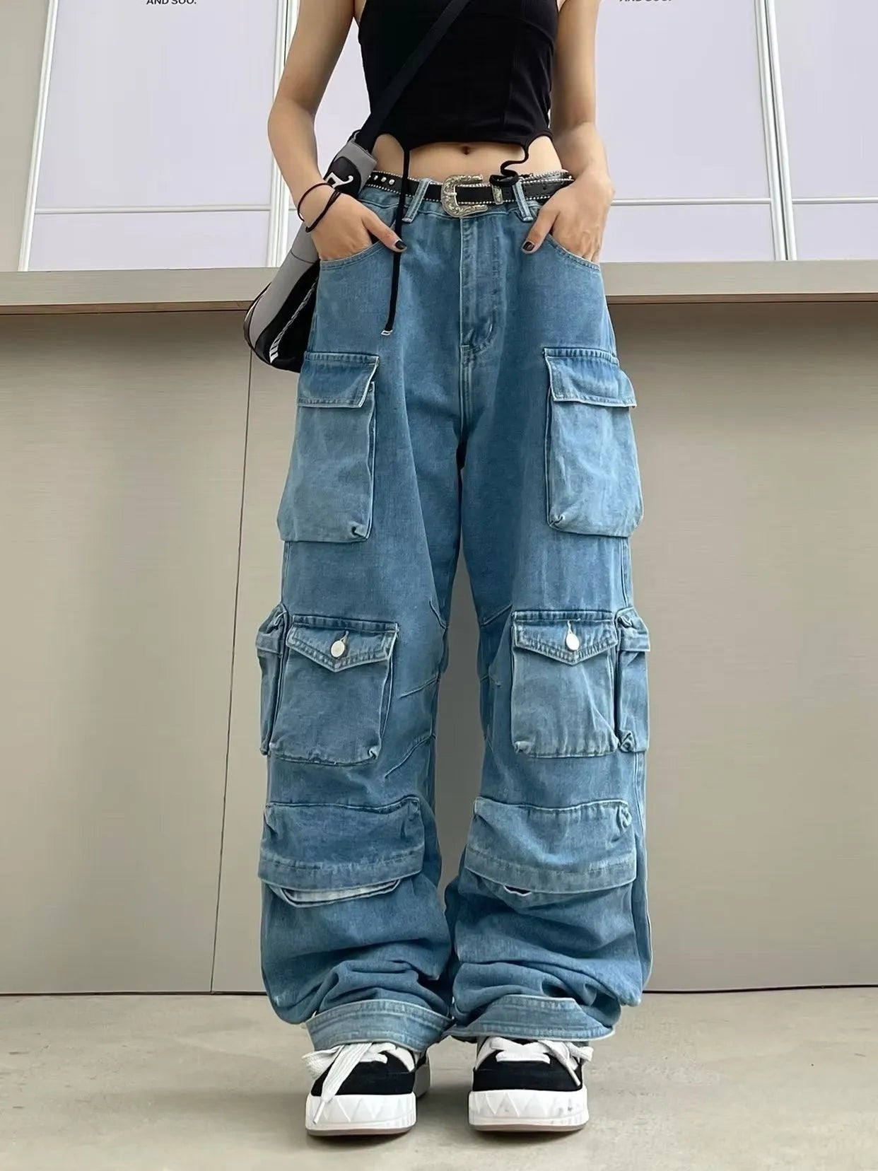 Women's high waist wide leg denim trousers with multiple pockets in tie-dyed blue colour