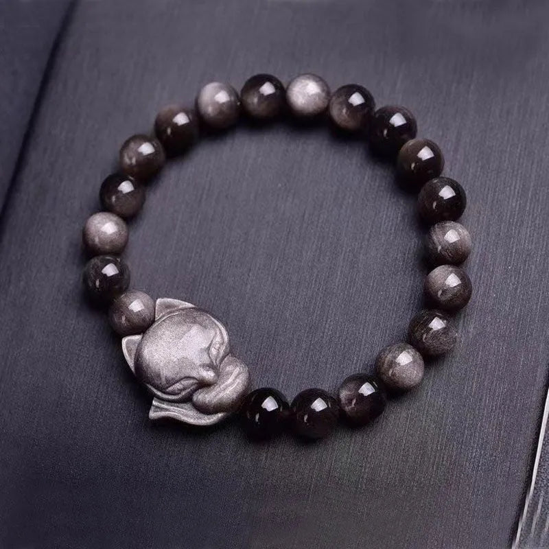 Obsidian fox bracelet with 8mm polished bead and fox charm on black elastic cord