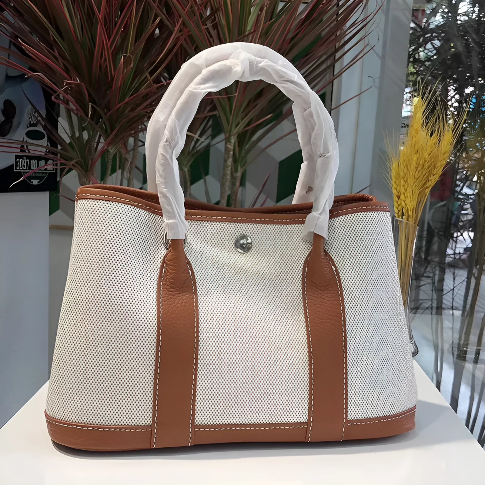 Genuine leather women's crossbody tote bag with canvas lining in bucket shape