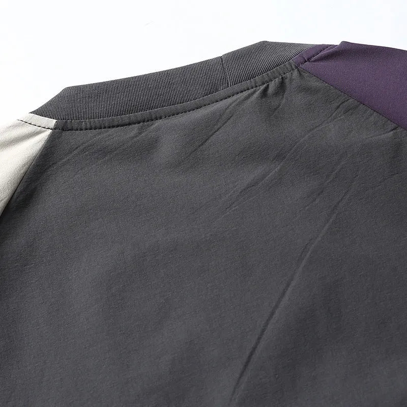 Dark grey men's loose fit t-shirt with contrasting colour panels on the raglan sleeves.