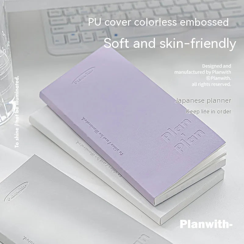 Embossed meter book notebook open showing white 100g paper, with blue, grey, purple, and white cover options.