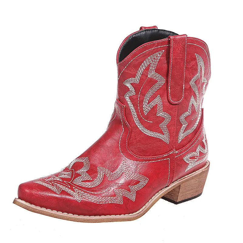 Blue women's cowboy boots with floral embroidery, a wedge heel, and a pointed toe.