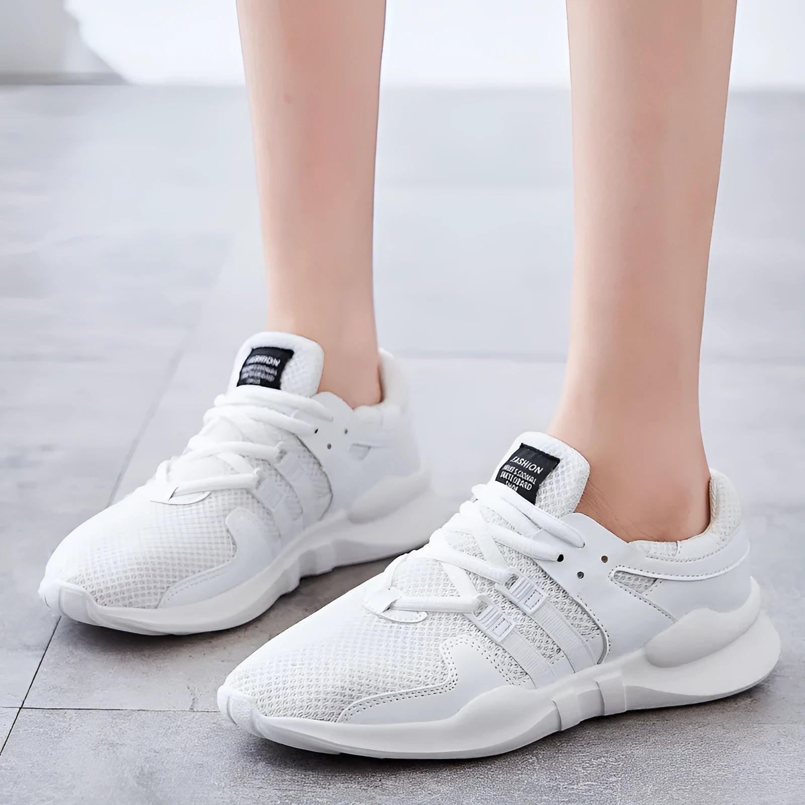 Casual low-top sneaker with mesh upper and hollow breathable design for summer wear