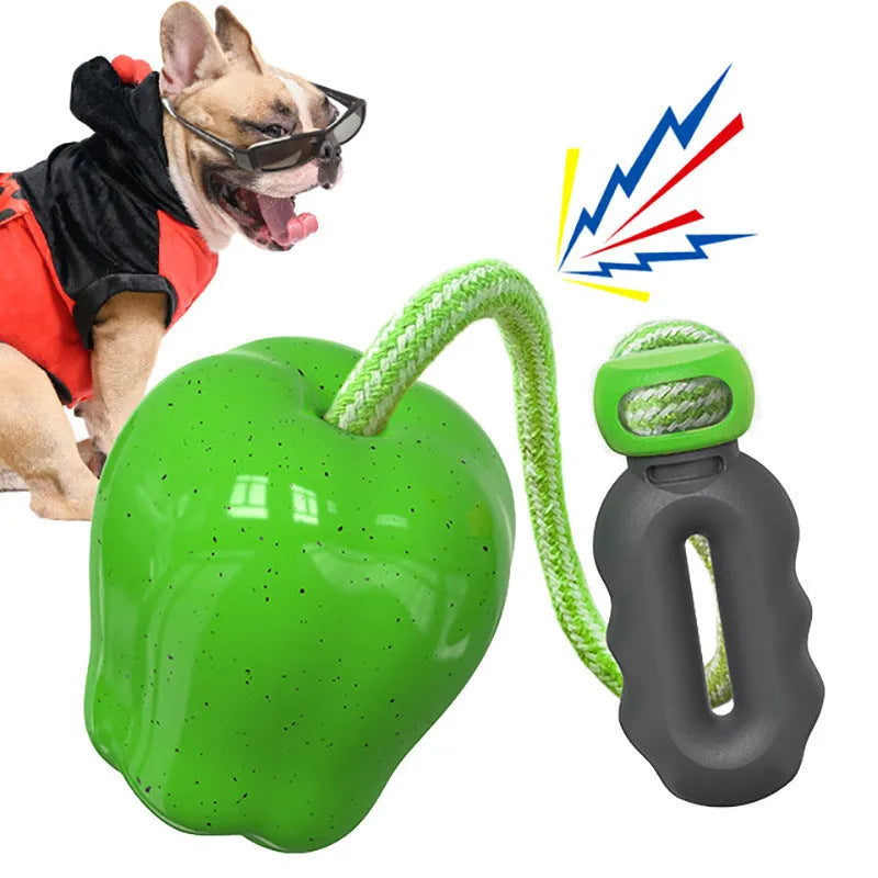 Green plastic dog food dropping ball molar toy with apple design for interactive feeding and chewing