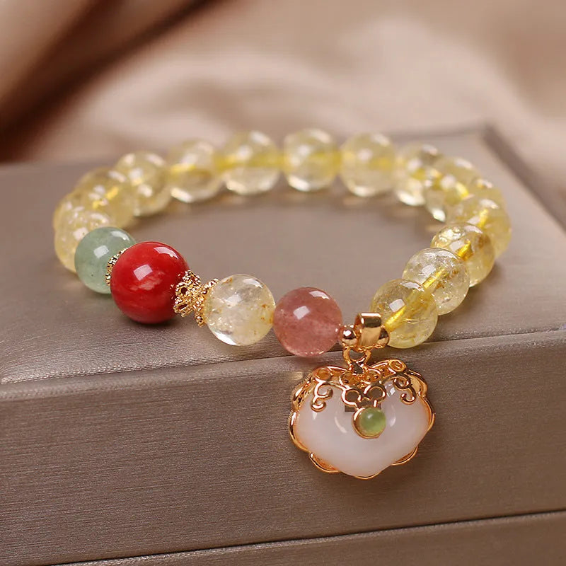 Women's yellow hair crystal jade Ruyi pendant on an alloy bracelet.