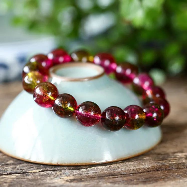 Handmade watermelon crystal bracelet with pastoral design elements on female wrist