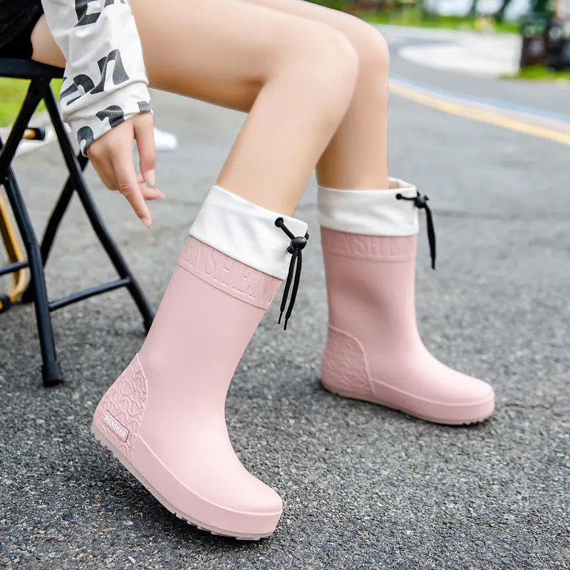 Women's PVC rain boots in solid colours with non-slip soles and waterproof mouth design