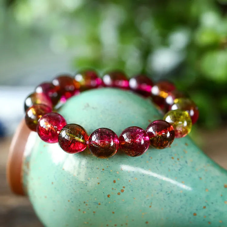 Handmade watermelon crystal bracelet with pastoral design elements on female wrist