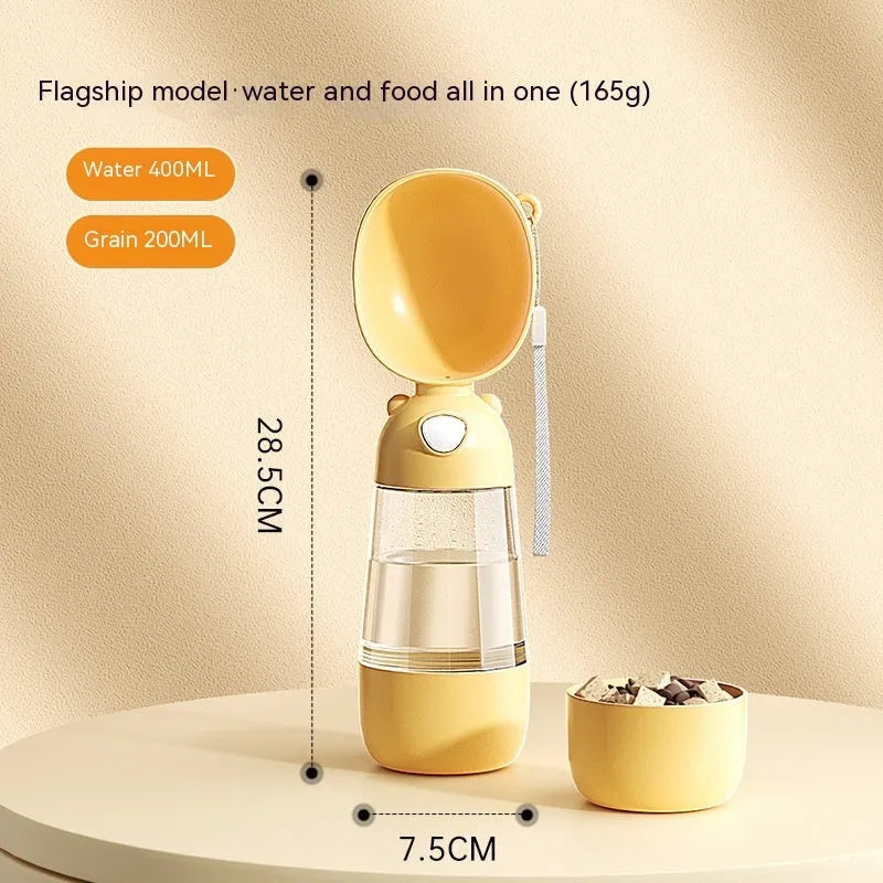 Portable dog water bottle with an attached feeding bowl in yellow, for outdoor travel.