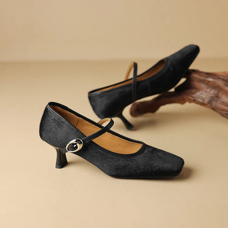 Women's black square toe stiletto heel ankle-strap shoes with horse hair upper.