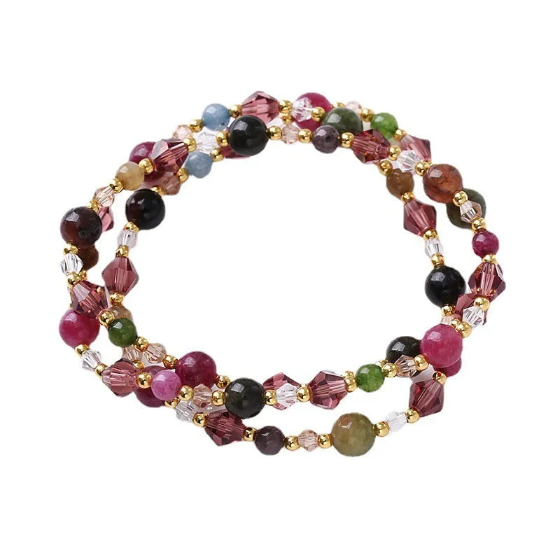 Women's adjustable three-ring crystal bracelet with colourful gemstones on wrist