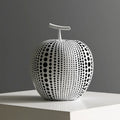 Resin decorative sculptures of apples and pears in black, white, orange and blue colours.