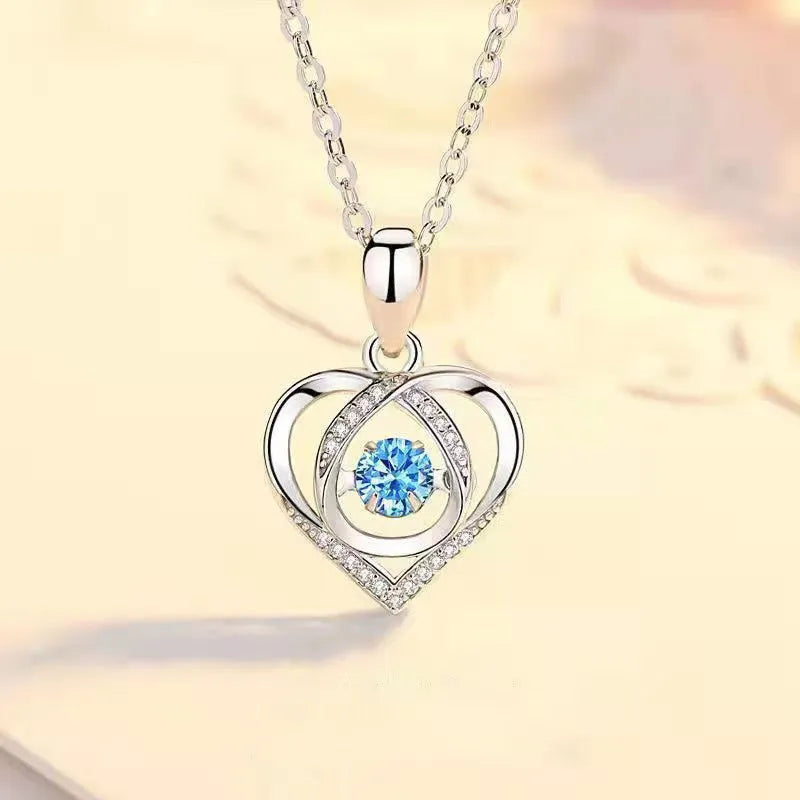 Blue diamond heart pendant necklace and matching bracelet jewellery set on copper