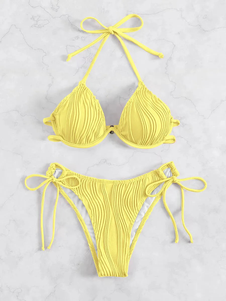Women's apricot coloured bikini swimsuit with underwire support on a mannequin.