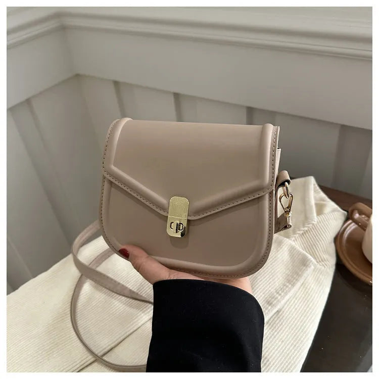 Soft textured PU leather messenger bag with clamshell opening, shown in a horizontal square shape.
