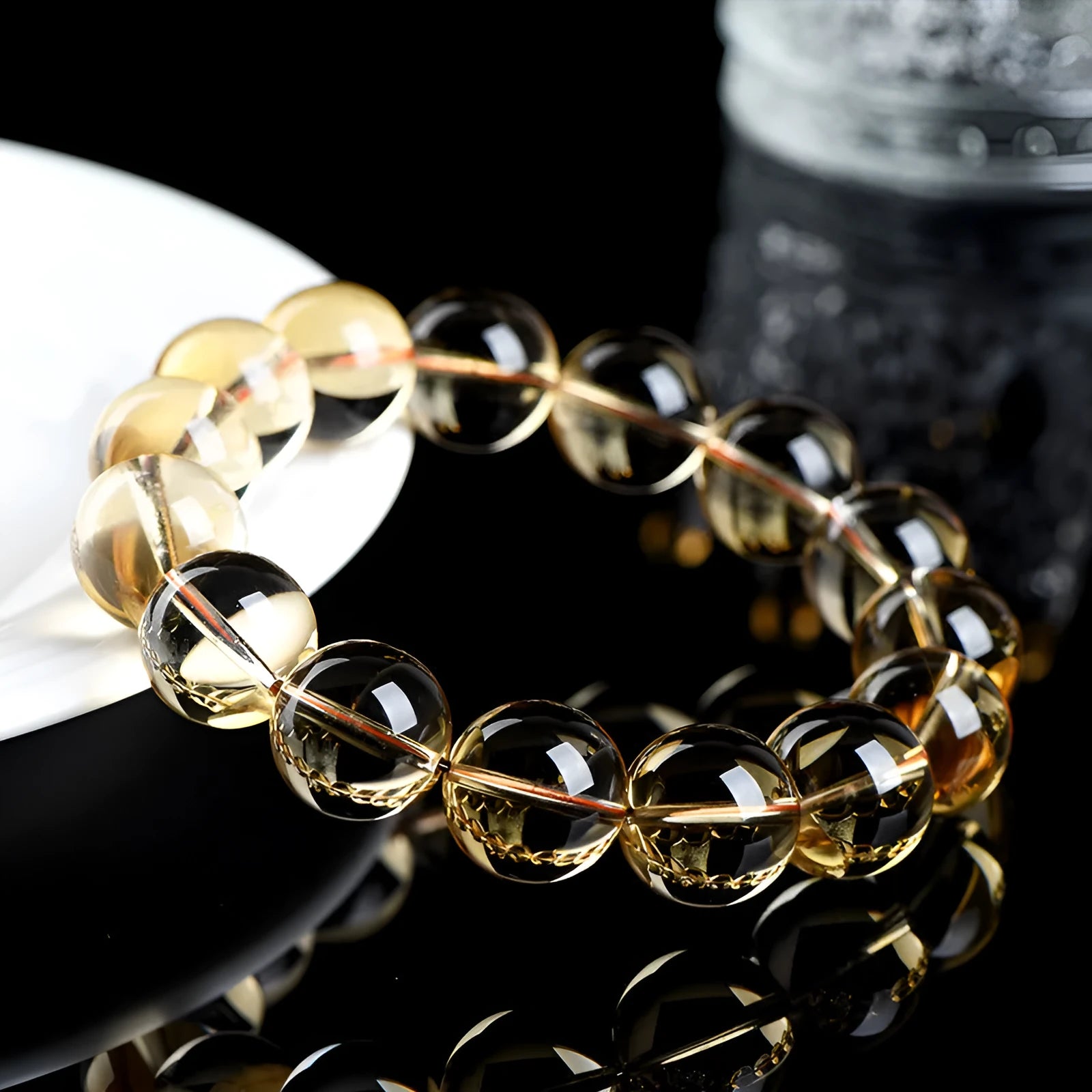 Natural citrine scattered beads ball bracelet showing polished stones in yellow-amber hues on a white background.