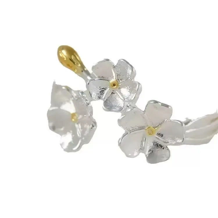 3D floral jasmine ring with heart, drop, and bell patterns on an adjustable open band.