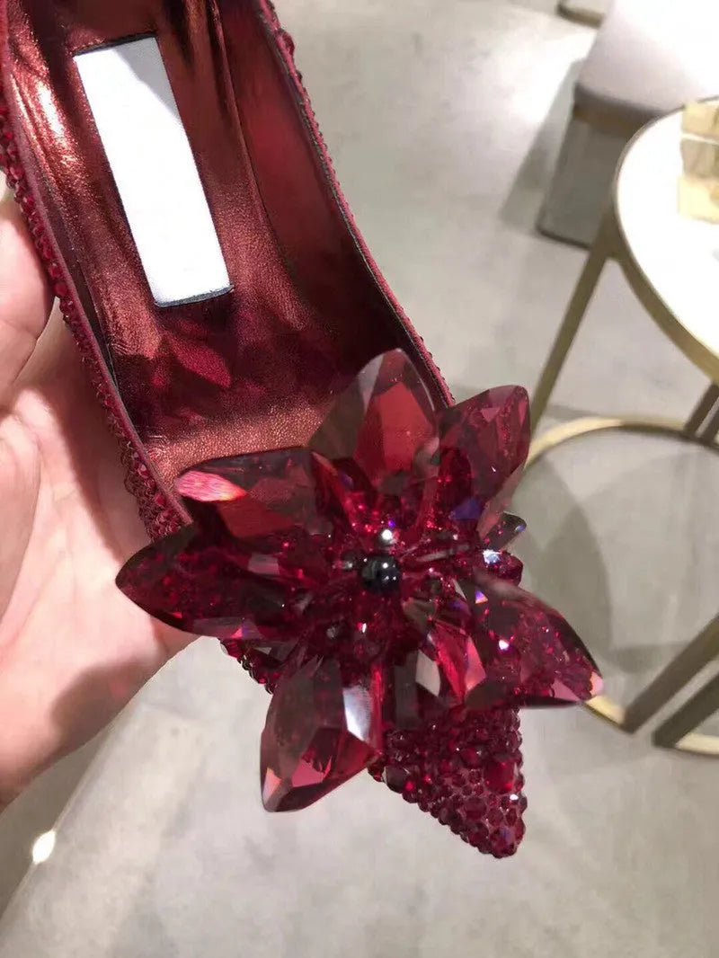 Women's gold high heels with pointed toes, rhinestone decoration, and stiletto heel