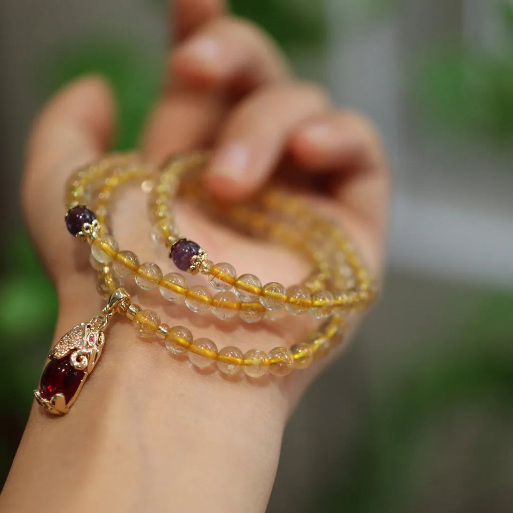 Natural Brazilian gold rutilated quartz bracelet with three gold rings in Chinese style design