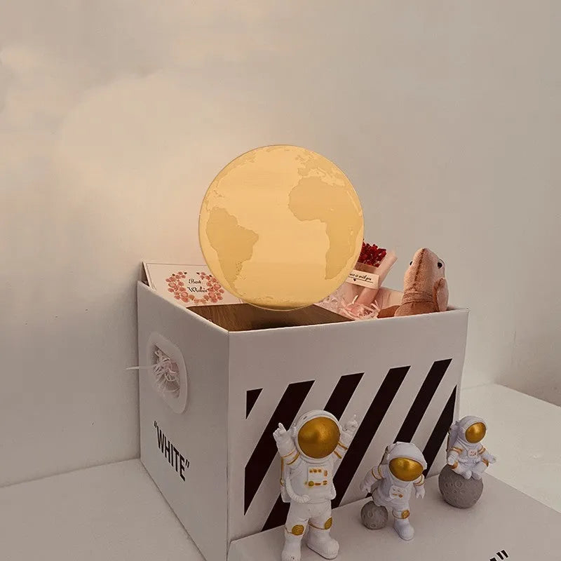 Maglev levitating planet night light floating above base with astronaut figurines