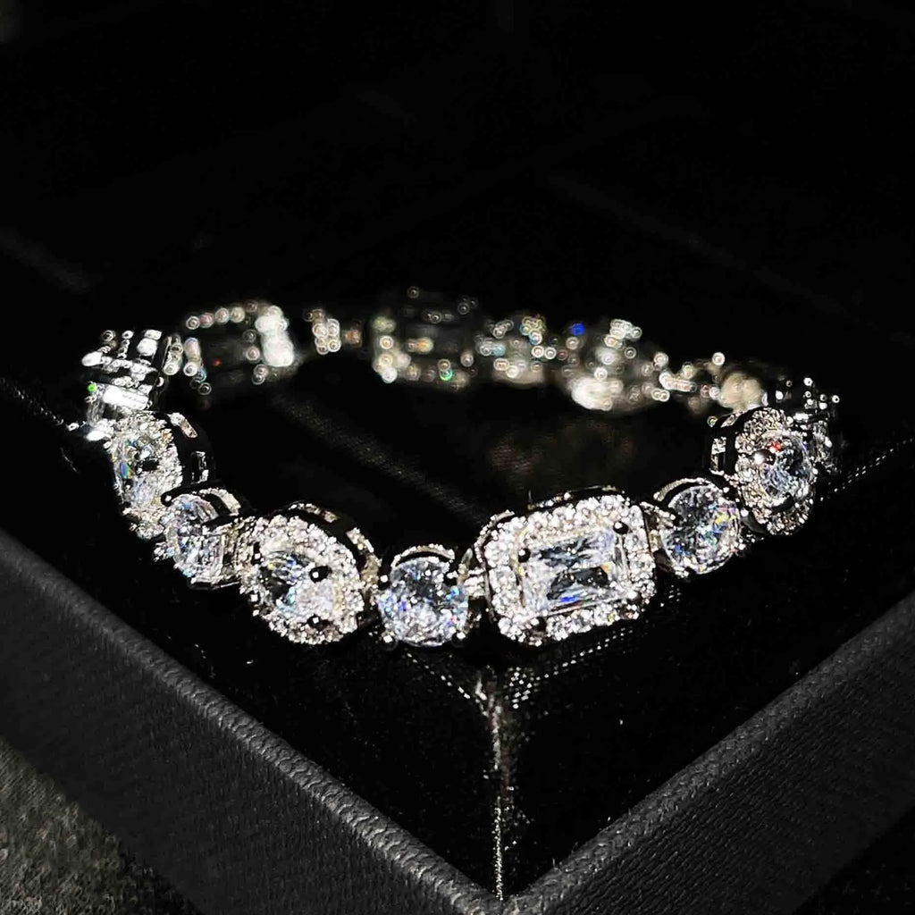 Women's geometric bracelet with zircon stones on silver-toned band showing adjustable and fixed length options