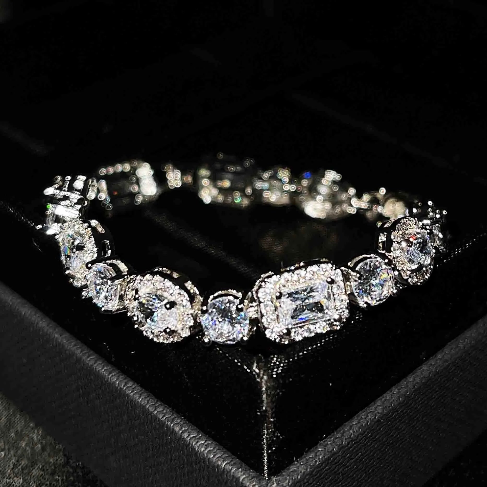 Women's geometric bracelet with zircon stones on silver-toned band showing adjustable and fixed length options
