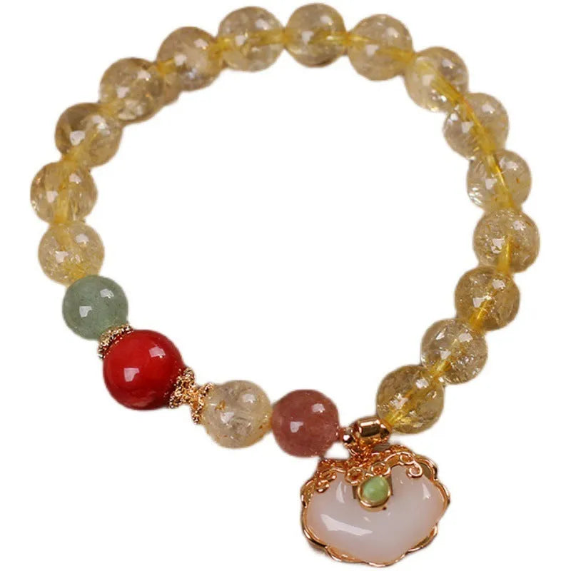 Women's yellow hair crystal jade Ruyi pendant on an alloy bracelet.