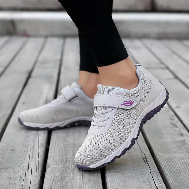 Women's low-top wedge heel shoes in grey purple with breathable mesh upper and Velcro strap.