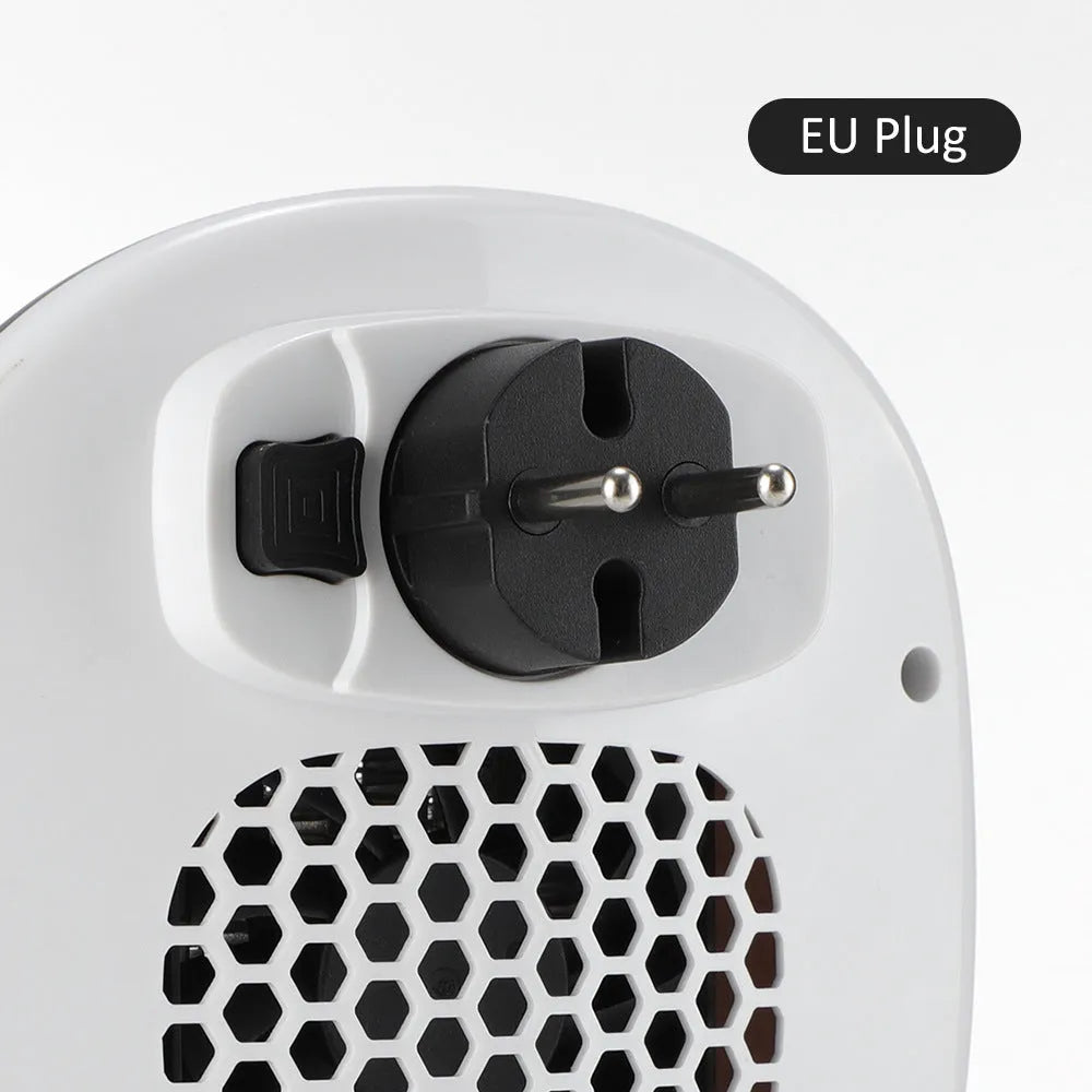 White ceramic heating electric heater with digital display and remote control on a table.