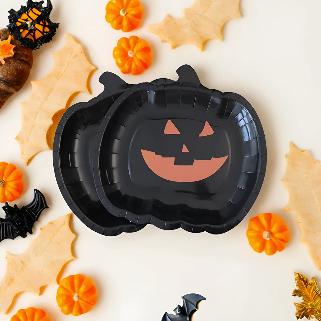 Black pumpkin-shaped disposable paper plates in 9-inch size for Halloween parties