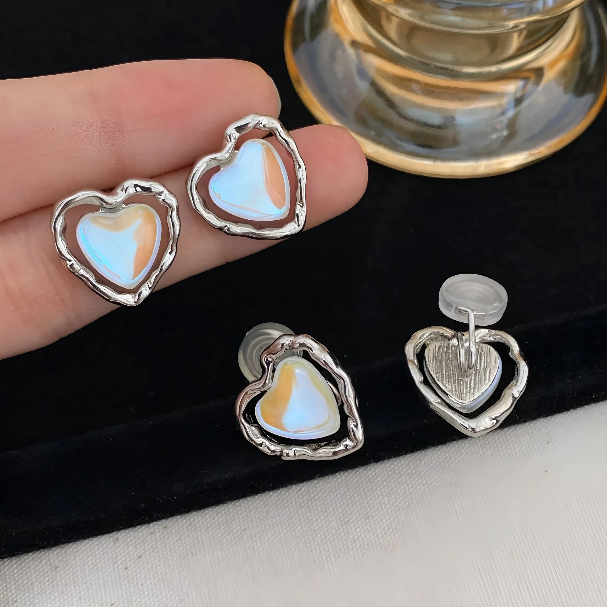 Women's alloy geometric heart earrings in ear clip and ear stud styles with electroplated finish