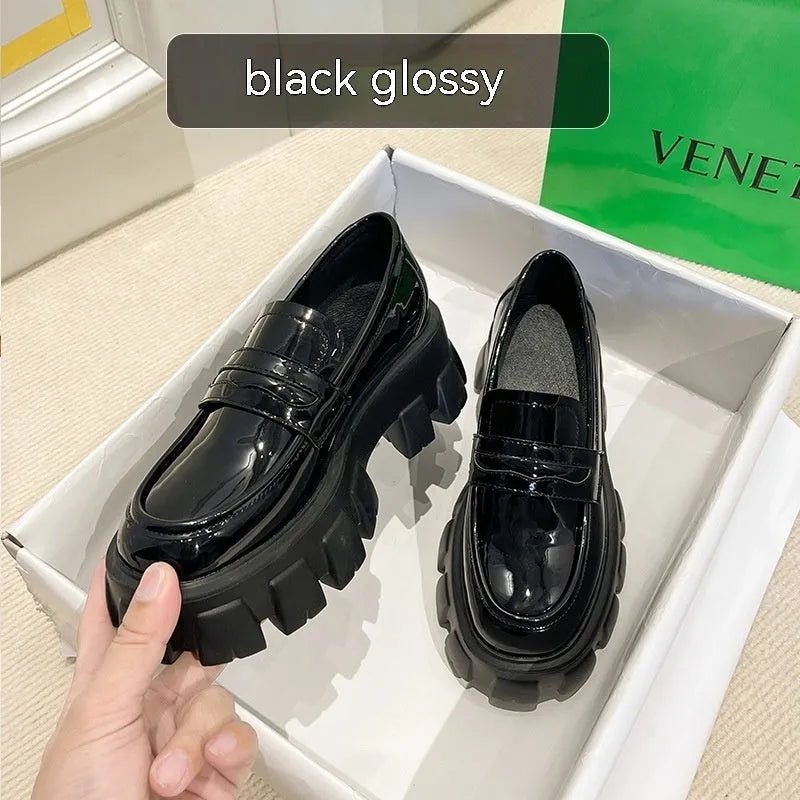 British style wide fat foot loafers in patent leather and matte finish, showing rubber sole and slip-on design.