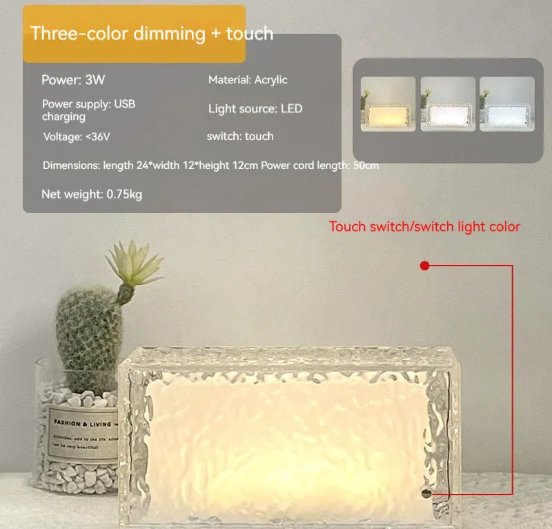 Clear geometric ice cube-shaped night lamp with multi-colour LED glow on a desk.