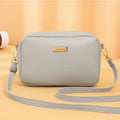 Women's solid colour PU leather shoulder bag with three-dimensional pockets in urban simplicity style