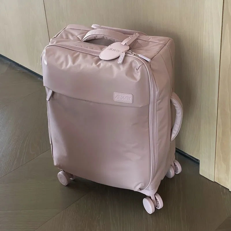 Ultra-light waterproof Oxford cloth suitcase with universal wheels in a bluestone green colour.