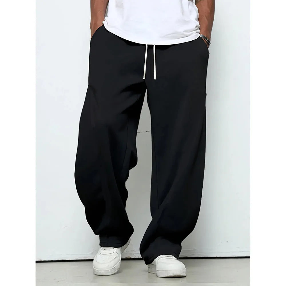 Men's straight-leg casual trousers in black with a micro-elastic waistband and drawstring closure.