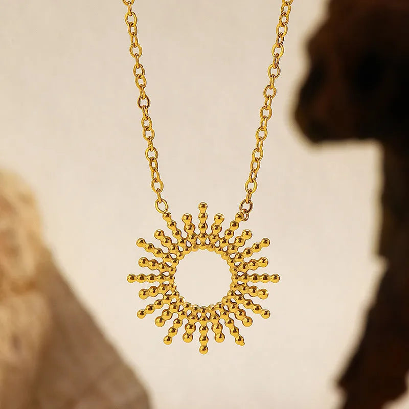 Sunflower jewellery set with gold necklace and bracelet featuring geometric chain design