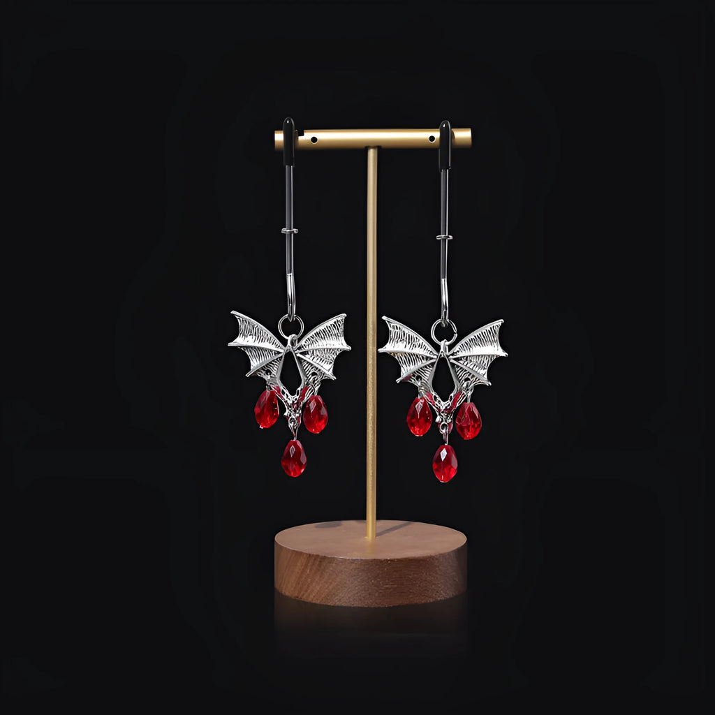 Silver alloy diamond bat nipple clamp set with ruby clip details and adjustable tension mechanism