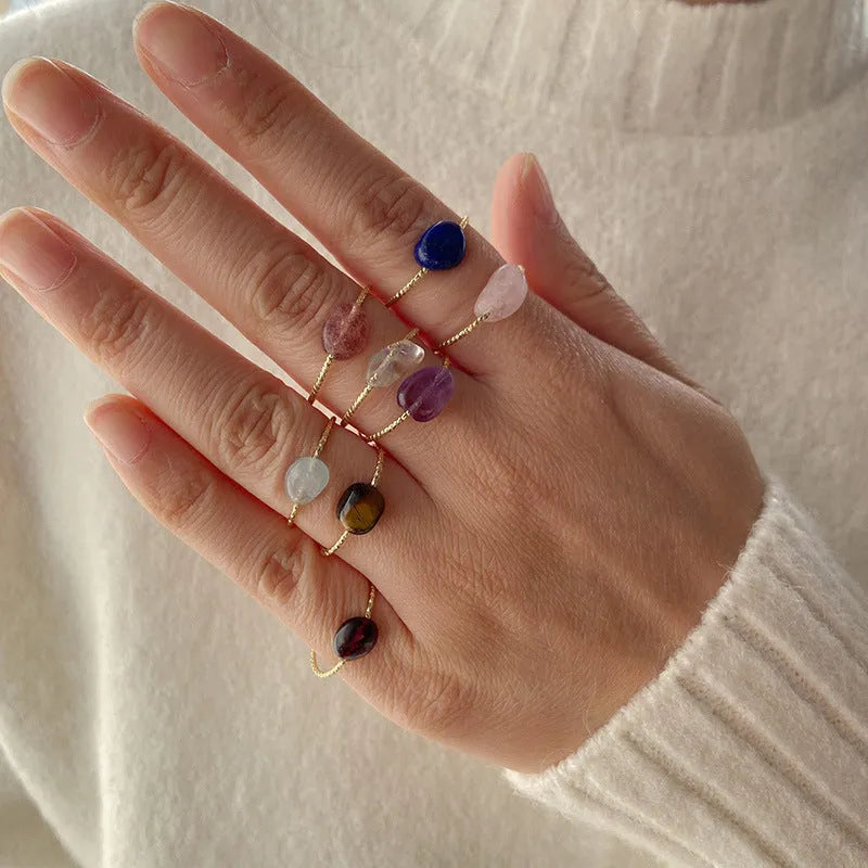 Geometric-shaped coloured agate ring for women with a polished stone finish, showing niche design details.