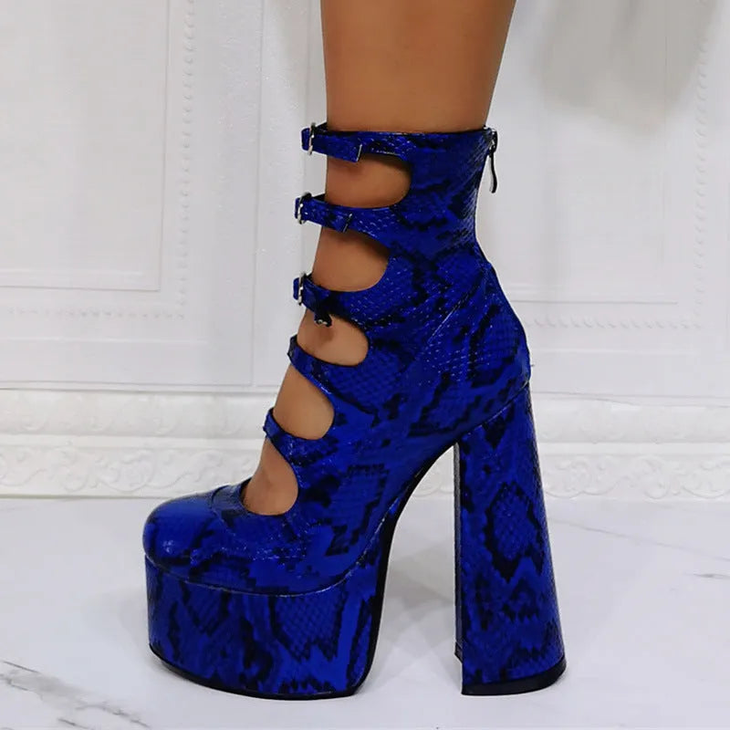 Women's black patent leather platform high heel boots with a thick heel, round toe, and serpentine ankle buckle.